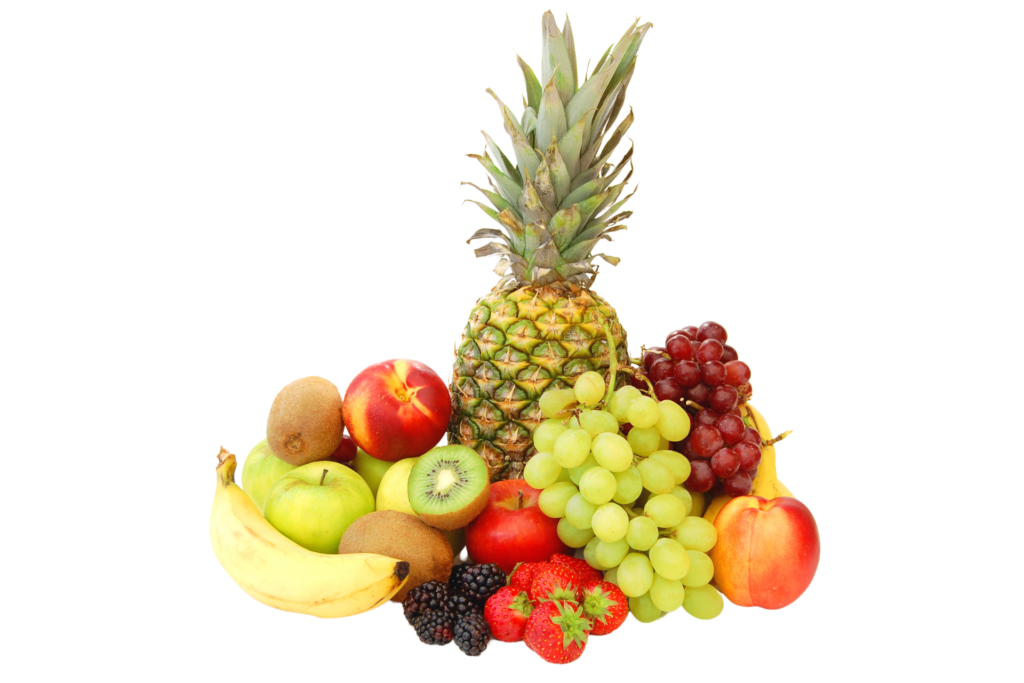 A vibrant tropical fruit mix of pineapple, grapes, apples, banana, kiwis, and strawberries arranged together on a white background.